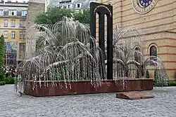Raoul Wallenberg Holocaust Memorial Park, Budapest. Made by Imre Varga in 1990, it resembles a weeping willow whose leaves bear inscriptions with the names of families of victims..