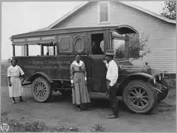 African-American agents and rural nurse with movable school