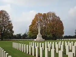 Graves and cross at the Bayeux Commonwealth War Graves Commission Cemetery