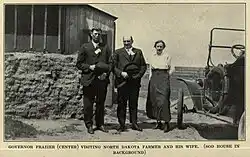 Governor Frazier (center) visiting North Dakota farmer and his wife. From the book "The Story of the Nonpartisan League: A Chapter in American Evolution".