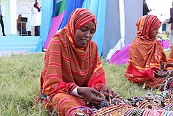 A Somali woman with traditional items