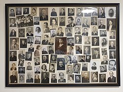 A collection of photographs of Jews in a frame hanging on a wall in the Central Archives of the History of the Jewish People