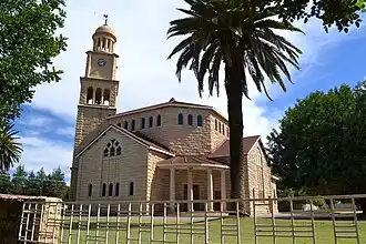 A photo showing an ornate Dutch Reformed Church in Wolmaransstad, South Africa.