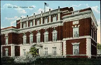 Vintage postcard of a brick building serving as an Elk's Lodge.