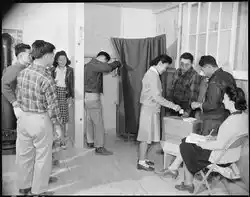 Jerome Relocation Center, Denson, Arkansas. Residents of Block 14 casting ballots to elect a block manager