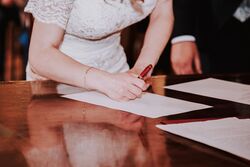 Signing the wedding papers in a civil ceremony