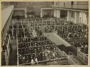 Immigrants fill the Ellis Island Registry Room, often called the Great Hall, sometime between 1902 and 1913.